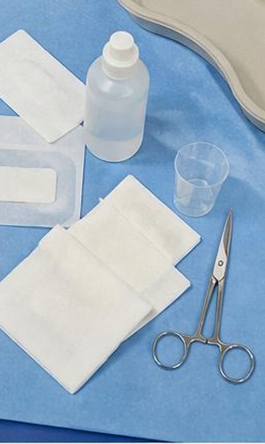 Sterile post-operative dressing kit — gauze, antiseptic, scissors, adhesive dressing for home wound care, follow-up Dr Jérémie Zeitoun breast surgical oncologist Paris